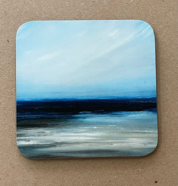 Image of a seascape with rocks in a light sea.