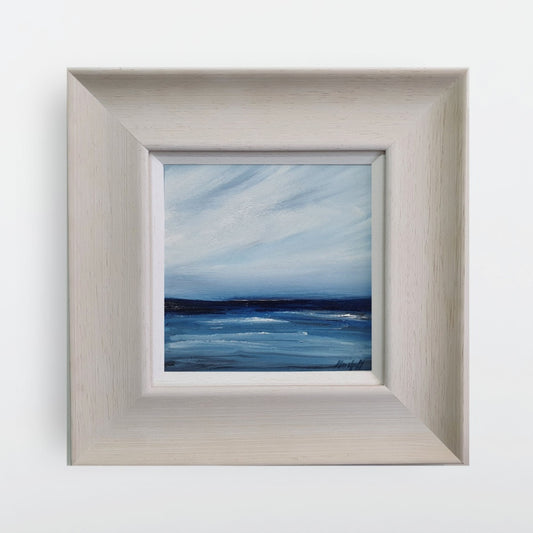 Berneray seascape with white whispy sky. Off-white broad frame.