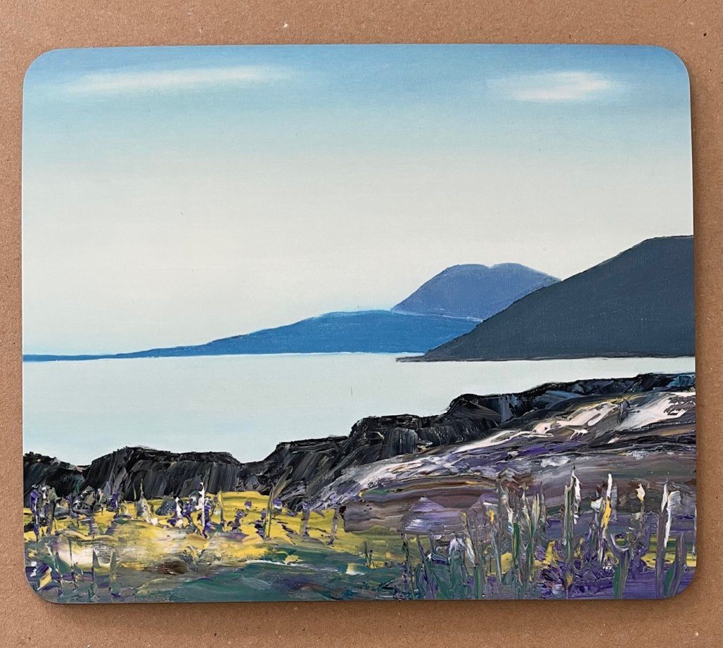 Painting of a white sandy beach and azure sea on a table mat.