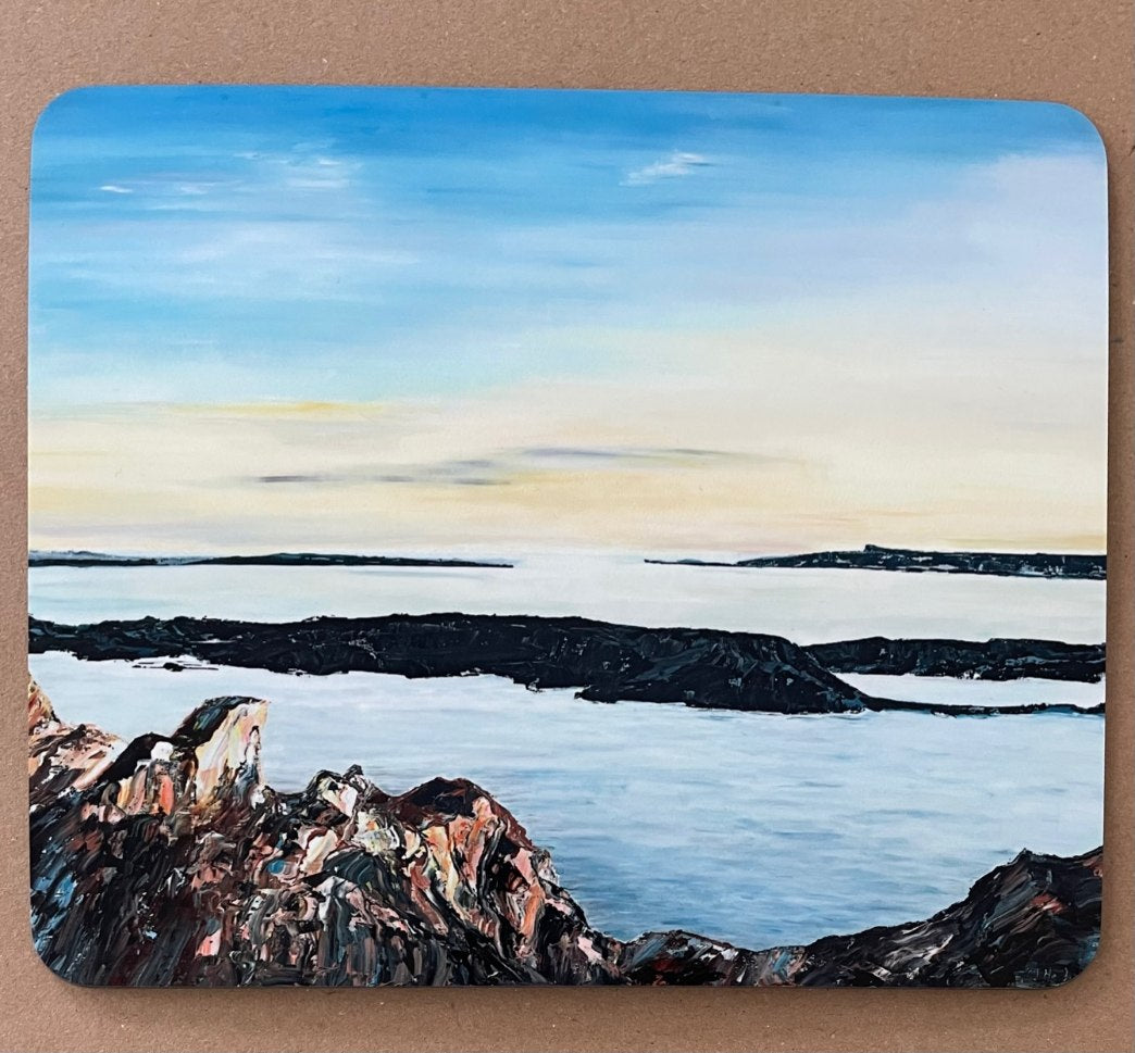 Table mat with seascape image.