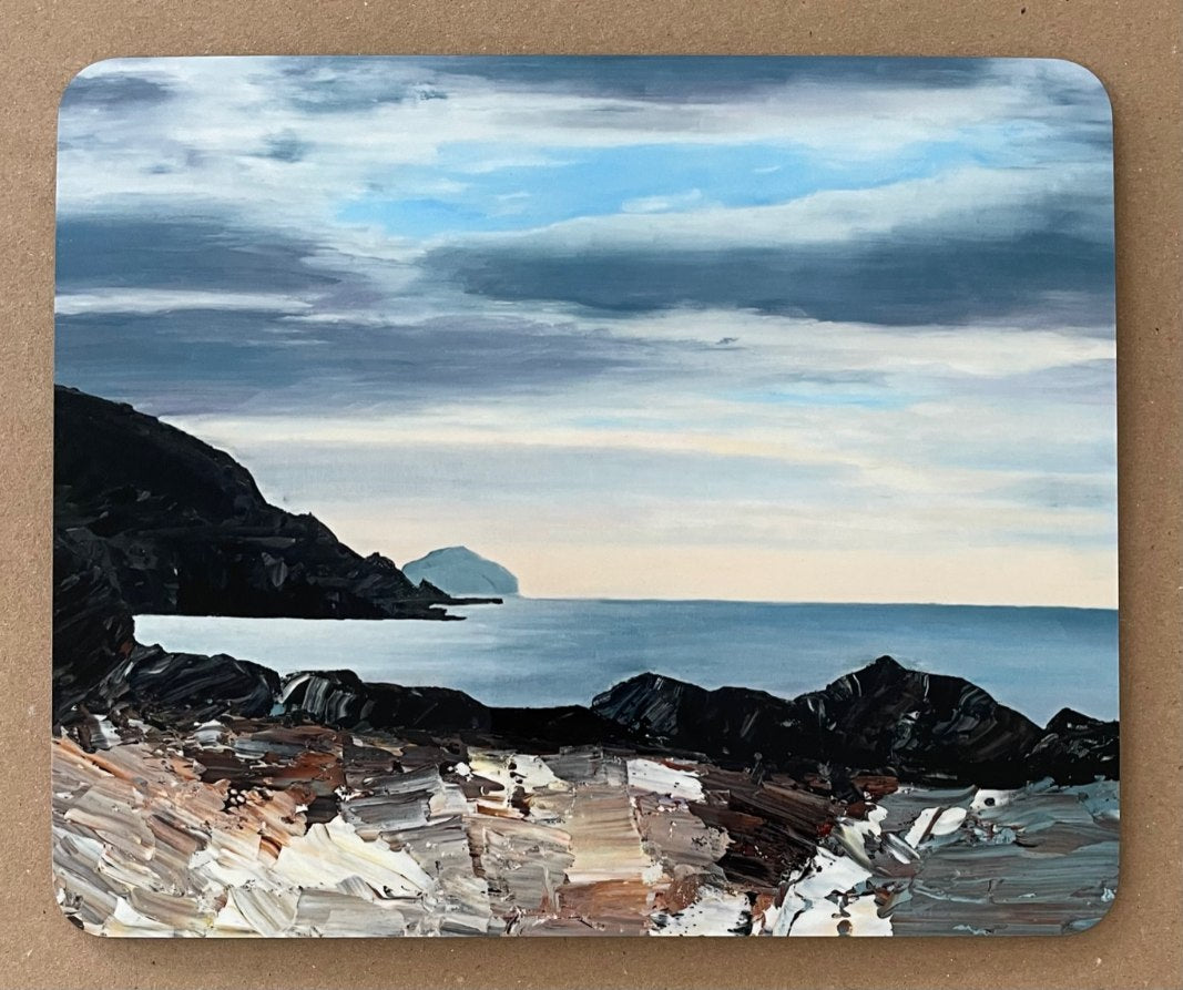 Table mat with an image of a dark, stormy Hebridean seascape.